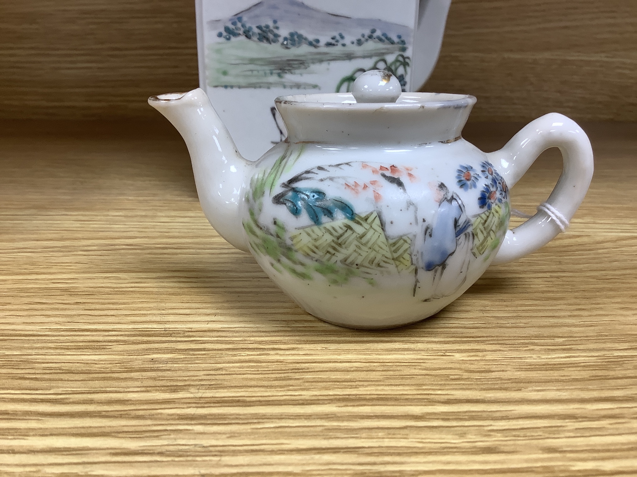 A Chinese enamelled porcelain square teapot and cover and a similar miniature teapot and cover, tallest 13cm